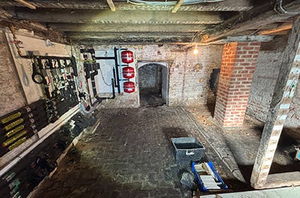 Basement waterproofing survey assessing below-ground damp and moisture risks